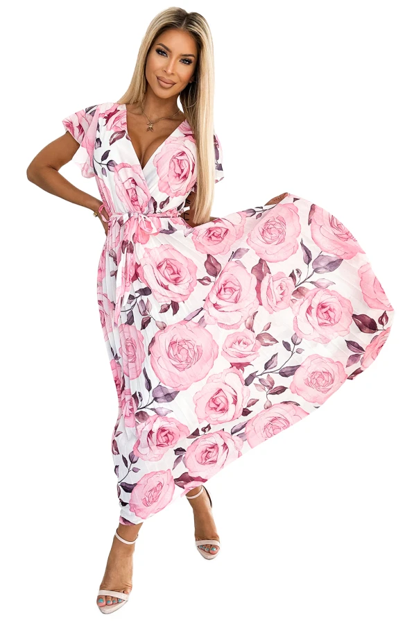 Rochie plisată elegantă cu imprimeu floral roz pe un fundal alb, având un design cu decolteu în V și mâneci scurte. Materialul ușor și fluid conferă o notă feminină și rafinată, perfectă pentru ocazii speciale.