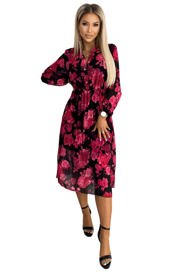 Rochie elegantă plisată, cu un imprimeu floral vibrant în nuanțe de roz pe un fundal negru. Designul său feminin și croiala lejeră o fac ideală pentru ocazii speciale sau evenimente de zi.