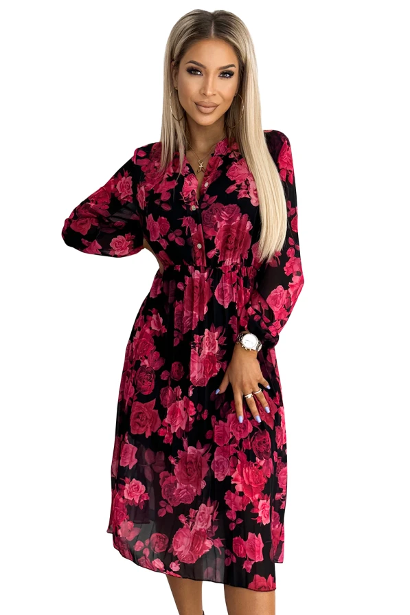 Rochia plisată Carla este elegantă și feminină, având un imprimeu floral vibrant în nuanțe de roz pe un fundal negru. Designul său cu mâneci lungi și talie accentuată oferă un aspect rafinat și sofisticat.
