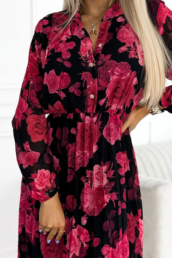 Rochia plisată Carla este decorată cu un imprimeu floral vibrant în nuanțe de roz și roșu pe un fundal negru. Materialul ușor și croiala elegantă oferă un aspect feminin și sofisticat.